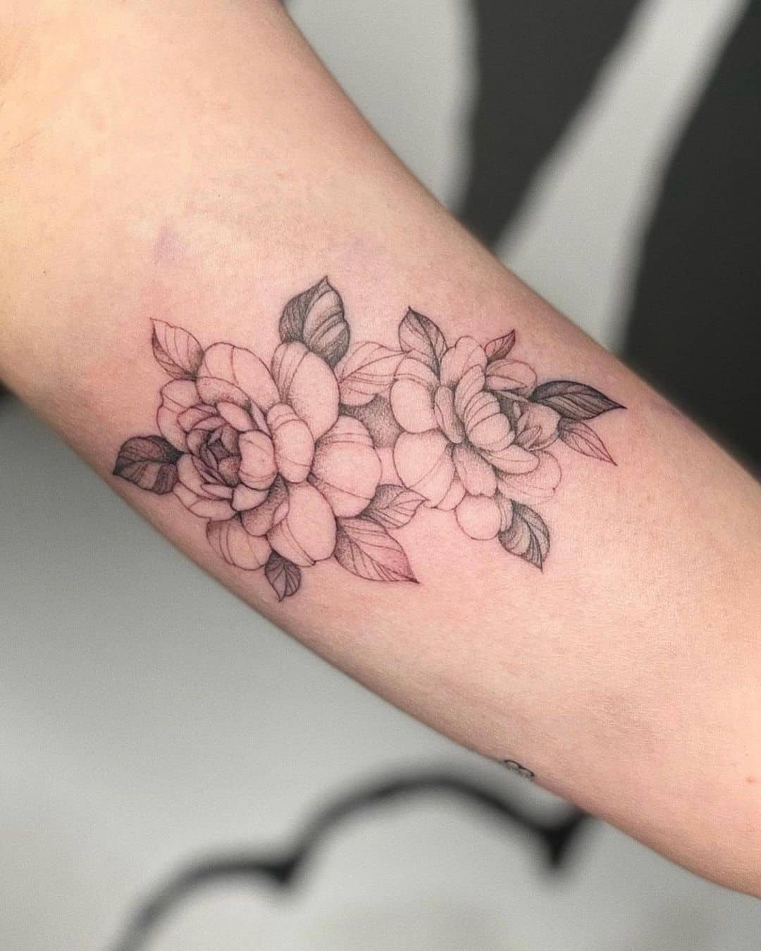 Fine line flower bouquet tattoo on Sasha Pieterses left inner forearm   Sunflower tattoo small Sunflower tattoo shoulder Cool small tattoos